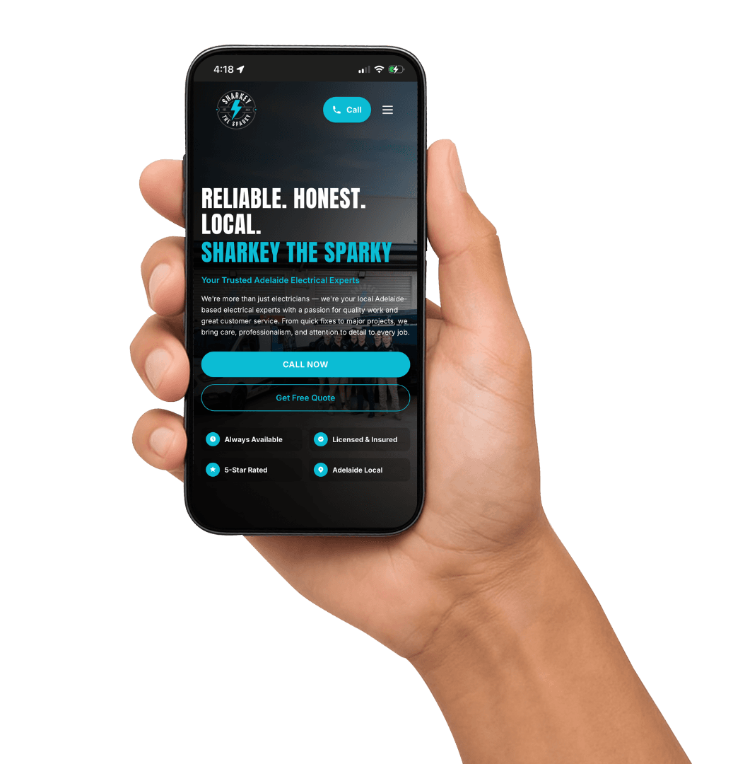 A hand holding a phone showing a client website